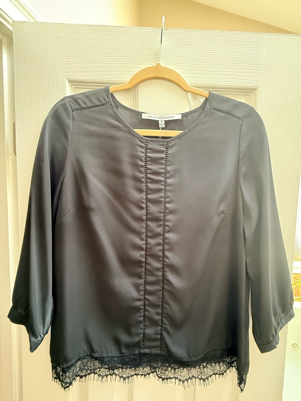 Collective Concepts Black Blouse with Lace Hem